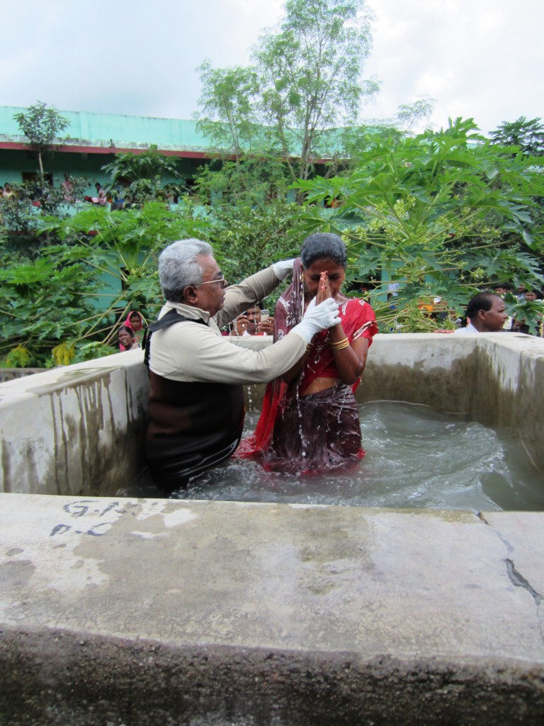 Dr. Dalavai baptizing August 25, 2011